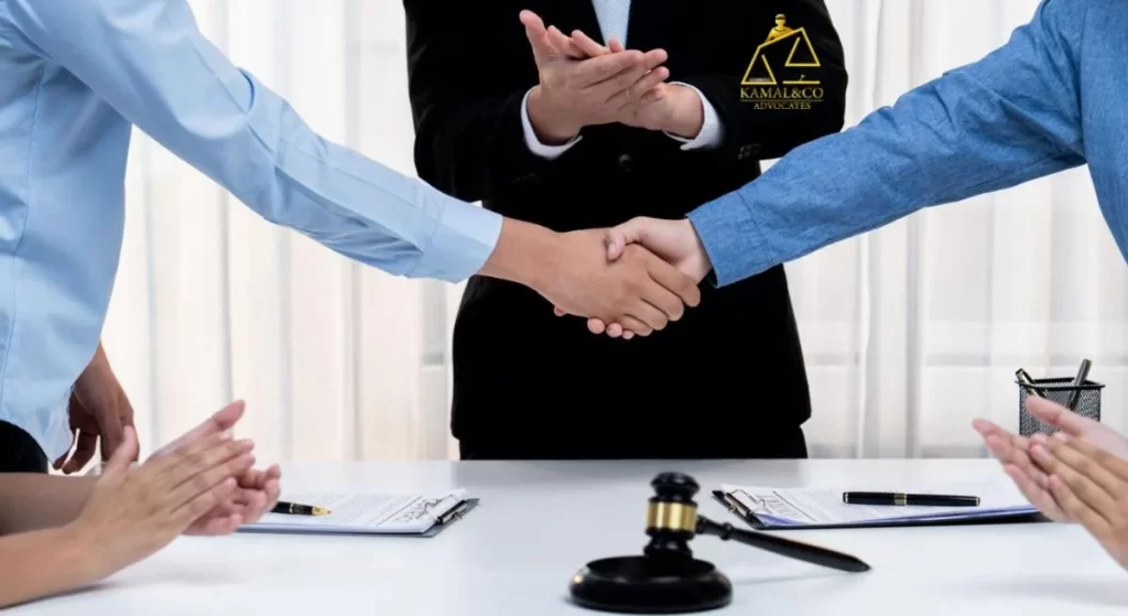 Benefits of divorce mediation – couple reaching peaceful settlement with mediator in a calm legal discussion setting